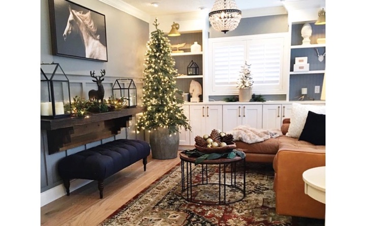 Living room with hardwood floors and shutters.